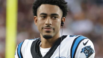 Oct 20, 2024; Landover, Maryland, USA; Carolina Panthers quarterback Bryce Young (9) looks on from the sidelines during the second half against the Washington Commanders at Northwest Stadium. Mandatory Credit: Amber Searls-Imagn Images