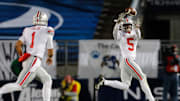 Ohio State Buckeyes quarterback Justin Fields throws a pass to wide receiver Garrett Wilson