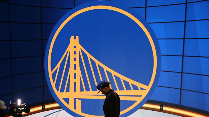 Jul 29, 2021; Brooklyn, New York, USA; Moses Moody (Arkansas) walks off the stage after being selected as the number fourteen overall pick by the Golden State Warriors in the first round of the 2021 NBA Draft at Barclays Center. Mandatory Credit: Brad Penner-Imagn Images