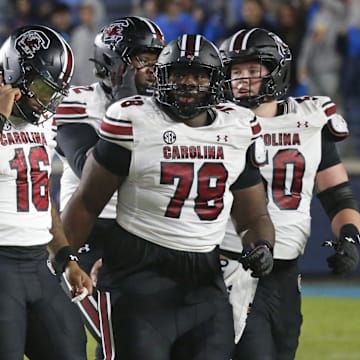 Nov 1, 2025; Oxford, Mississippi, USA; South Carolina Gamecocks quarterback LaNorris Sellers (16) and the rest of the offense walk off the field after a turnover during the fourth quarter against the Mississippi Rebels at Vaught-Hemingway Stadium. Mandatory Credit: Petre Thomas-Imagn Images