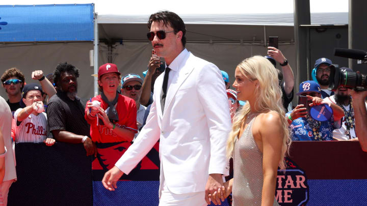 Jul 16, 2024; Arlington, Texas, USA; Pittsburgh Pirates pitcher Paul Skenes walks the red carpet with LSU gymnast and girlfriend Livvy Dunne before the 2024 MLB All-Star Game at Globe Life Field.