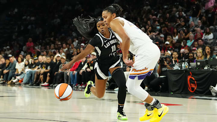 Oct 3, 2025; Las Vegas, Nevada, USA; Las Vegas Aces guard Dana Evans (11) tips the ball away from Phoenix Mercury forward Alyssa Thomas (25) during the second quarter of game one of the 2025 WNBA Finals at Michelob Ultra Arena. Mandatory Credit: Stephen R. Sylvanie-Imagn Images