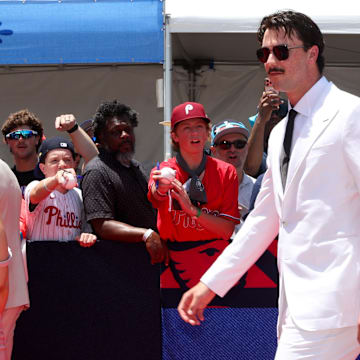 Jul 16, 2024; Arlington, Texas, USA; Pittsburgh Pirates pitcher Paul Skenes walks the red carpet with LSU gymnast and girlfriend Livvy Dunne before the 2024 MLB All-Star game at Globe Life Field. Mandatory Credit: Kevin Jairaj-Imagn Images