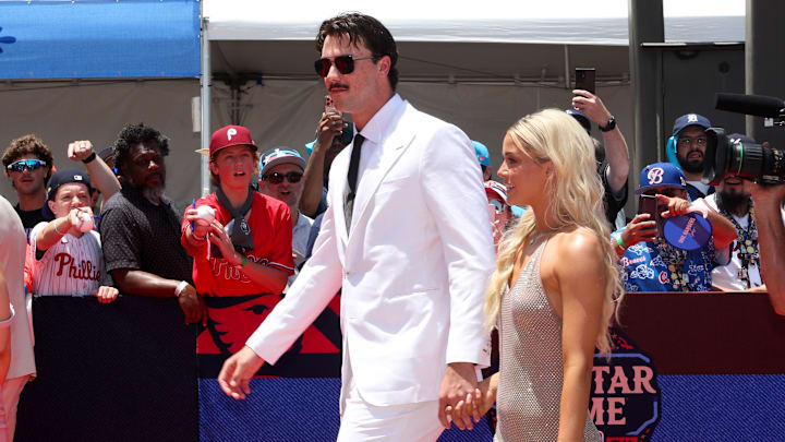 Jul 16, 2024; Arlington, Texas, USA; Pittsburgh Pirates pitcher Paul Skenes walks the red carpet with LSU gymnast and girlfriend Livvy Dunne before the 2024 MLB All-Star game at Globe Life Field. Mandatory Credit: Kevin Jairaj-Imagn Images