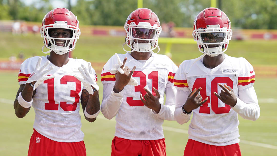 Jul 24, 2023; St. Joseph, MO, USA; Kansas City Chiefs safety Nazeeh Johnson (13) and cornerback Nic Jones (31) and cornerback Ekow Boye-Doe (40 pose for a photo on field after training camp at Missouri Western State University. Mandatory Credit: Denny Medley-USA TODAY Sports