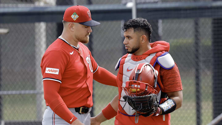 Feb 19, 2026; West Palm Beach, FL, USA;  Washington Nationals pitcher Cade Cavalli (24) thanks catcher Keibert Ruiz  (20) (right) during spring training workouts at CACTI Park of the Palm Beaches. Mandatory Credit: Reinhold Matay-Imagn Images