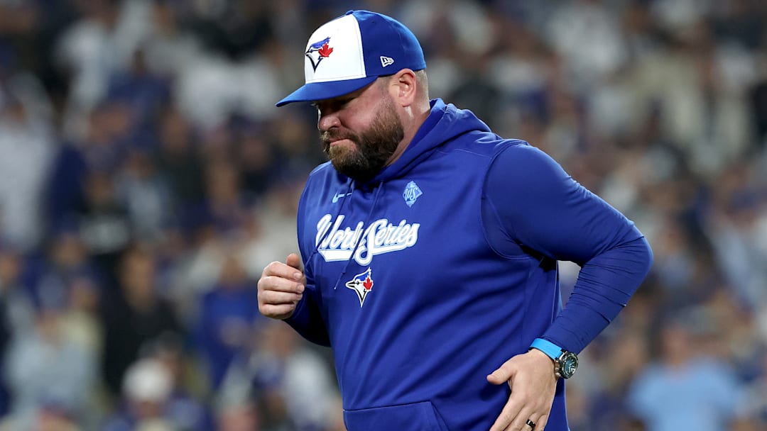 Toronto Blue Jays manager John Schneider jogs to the mound during Game 3 of the 2025 World Series.