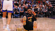 Mar 19, 2025; Sacramento, California, USA; Cleveland Cavaliers guard Donovan Mitchell (45) on the floor after being fouled by Sacramento Kings guard Devin Carter (22) during the fourth quarter at Golden 1 Center. Mandatory Credit: Kelley L Cox-Imagn Images
