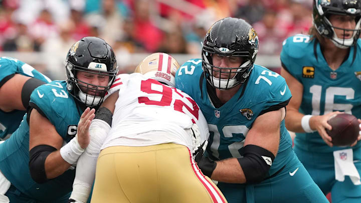 Sep 28, 2025; Santa Clara, California, USA; Jacksonville Jaguars center Robert Hainsey (73) and offensive tackle Walker Little (72) block San Francisco 49ers defensive tackle Jordan Elliott (92) during the fourth quarter at Levi's Stadium. Mandatory Credit: Darren Yamashita-Imagn Images