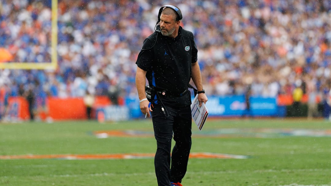 Oct 4, 2025; Gainesville, Florida, USA; Florida Gators head coach Billy Napier inspects the line of scrimmage against the Texas Longhorns during the first half at Ben Hill Griffin Stadium.