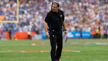Oct 4, 2025; Gainesville, Florida, USA; Florida Gators head coach Billy Napier inspects the line of scrimmage against the Texas Longhorns during the first half at Ben Hill Griffin Stadium.