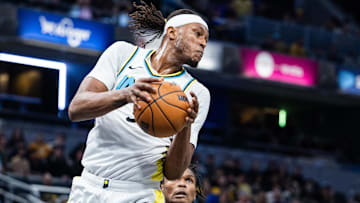 Jan 29, 2025; Indianapolis, Indiana, USA; Indiana Pacers center Myles Turner (33) rebounds the ball  in the second half against the Detroit Pistons at Gainbridge Fieldhouse. Mandatory Credit: Trevor Ruszkowski-Imagn Images