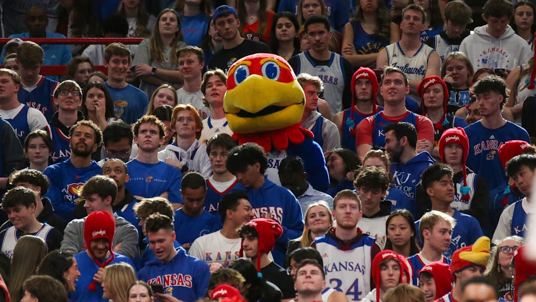Jan 18, 2025; Lawrence, Kansas, USA; The Kansas Jayhawks mascot joins students in the stands to watch part of the second half against the Kansas State Wildcats at Allen Fieldhouse. Mandatory Credit: Scott Sewell-Imagn Images