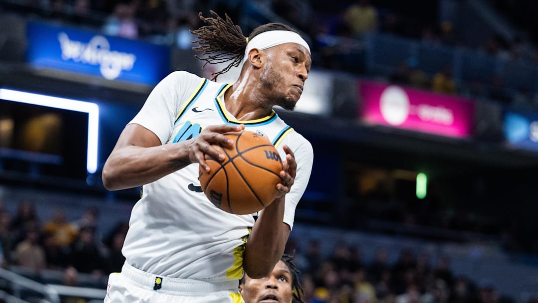 Jan 29, 2025; Indianapolis, Indiana, USA; Indiana Pacers center Myles Turner (33) rebounds the ball  in the second half against the Detroit Pistons at Gainbridge Fieldhouse. Mandatory Credit: Trevor Ruszkowski-Imagn Images