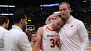 Senior Wisconsin guard Brad Davison (34)is embraced by assistant coach Joe Krabbenhoft after their second round game of the 2022 NCAA Men's Basketball Tournament Sunday, March 20, 2022 at Fiserv Forum in Milwaukee, Wis. Iowa State beat Wisconsin 54-49.

Mjs Uwmen21 Page 1 Jpg Ncaa21

Syndication Journal Sentinel