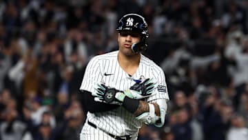 Oct 29, 2024; Bronx, New York, USA;  New York Yankees second baseman Gleyber Torres (25) reacts after hitting a three run home run against the Los Angeles Dodgers in the eighth inning during game four of the 2024 MLB World Series at Yankee Stadium. Mandatory Credit: Vincent Carchietta-Imagn Images