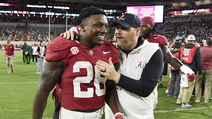 Sep 7, 2024; Tuscaloosa, Alabama, USA;  Alabama Crimson Tide running back Jam Miller (26) celebrates with defensive coordinator Kane Wommack as he leaves the field after defeating the South Florida Bulls at Bryant-Denny Stadium. Mandatory Credit: Gary Cosby Jr.-Imagn Images