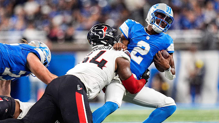 Detroit Lions quarterback Hendon Hooker (2) is sacked by Houston Texans defensive tackle Haggai Ndubuisi (64) during the second half at Ford Field in Detroit on Saturday, August 23, 2025.
