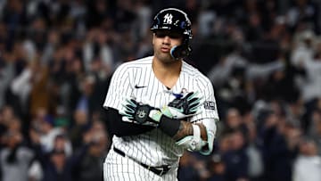 Oct 29, 2024; Bronx, New York, USA;  New York Yankees second baseman Gleyber Torres (25) reacts after hitting a three run home run against the Los Angeles Dodgers in the eighth inning during game four of the 2024 MLB World Series at Yankee Stadium. Mandatory Credit: Vincent Carchietta-Imagn Images