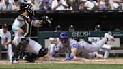 Chicago Cubs second baseman Nico Hoerner (2) slides safely into home plate at Rate Field. 