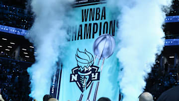 May 17, 2025; Brooklyn, New York, USA;  The 2024 WNBA Champions banner is raised prior to the game between the Las Vegas Aces and the against the New York Liberty at Barclays Center. Mandatory Credit: Wendell Cruz-Imagn Images