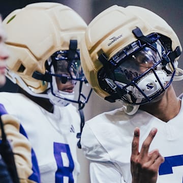 Ephesians Prysock (7), shown here with Tacario Davis, played with him at Arizona and now at the UW. 