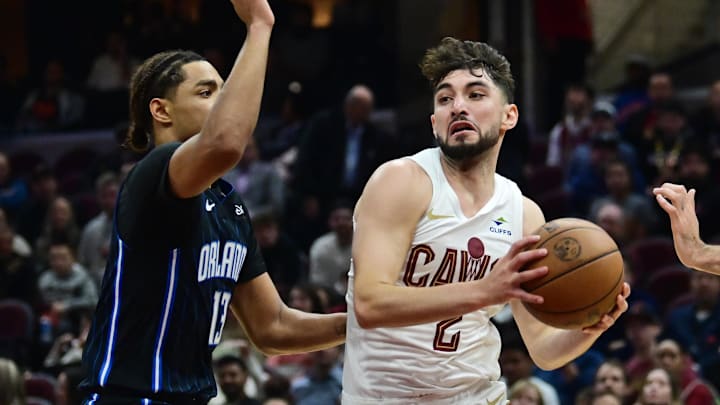 Oct 12, 2023; Cleveland, Ohio, USA; Cleveland Cavaliers guard Ty Jerome (2) drives to the basket against Orlando Magic guard Jett Howard (13) during the second half at Rocket Mortgage FieldHouse. Mandatory Credit: Ken Blaze-Imagn Images