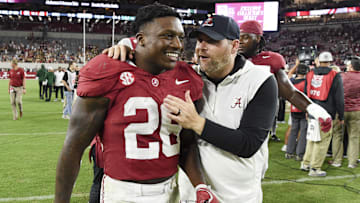 Sep 7, 2024; Tuscaloosa, Alabama, USA;  Alabama Crimson Tide running back Jam Miller (26) celebrates with defensive coordinator Kane Wommack as he leaves the field after defeating the South Florida Bulls at Bryant-Denny Stadium. Mandatory Credit: Gary Cosby Jr.-Imagn Images
