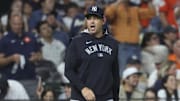 Sep 3, 2025; Houston, Texas, USA; New York Yankees manager Aaron Boone looks towards home plate during a pitching change in the eighth inning against the Houston Astros at Daikin Park. Mandatory Credit: Troy Taormina-Imagn Images
