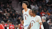 Dec 8, 2024; San Antonio, Texas, USA;  San Antonio Spurs center Victor Wembanyama (1) and guard Stephon Castle (5) walk toward the bench in the second half against the New Orleans Pelicans at Frost Bank Center. Mandatory Credit: Daniel Dunn-Imagn Images