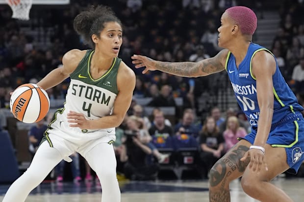 Seattle Storm guard Skylar Diggins (4) brings the ball up against Minnesota Lynx guard Courtney Williams (10)