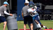 Tennessee Titans running back Jonathan Ward (33) carriers the ball as he runs through a drill during
