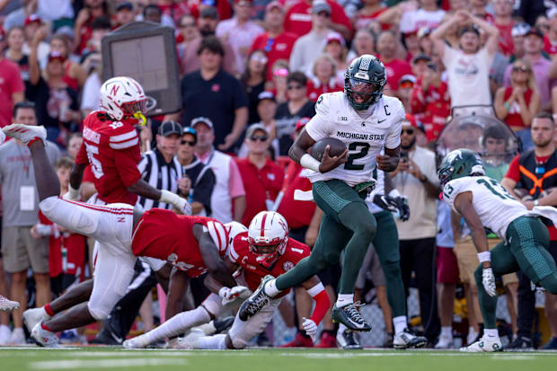 Michigan State Spartans quarterback Aidan Chiles rushes for a touchdown during the game against Nebraska at Memorial Stadium.