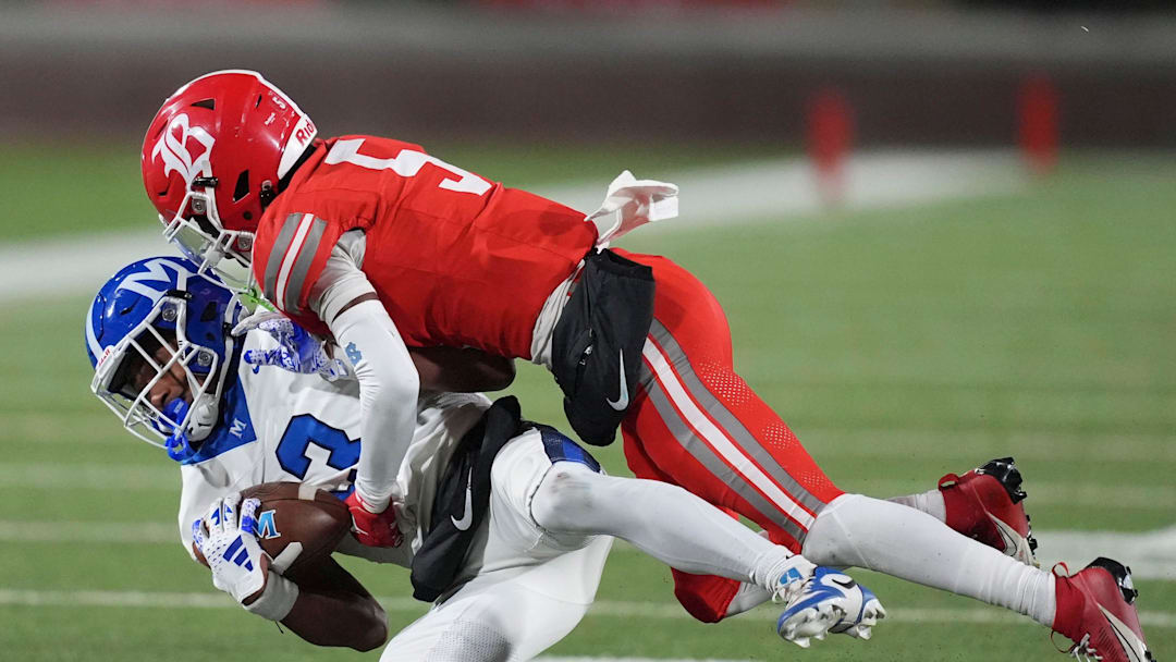 McCallie's Loia Valade (13) is tackled by Baylor's Jamyan Theodore (5) during the TSSAA Division II-AAA high school football Bluecross Bowl on Thursday, Dec. 5, 2024, in Chattanooga, Tenn. McCallie's Loia Valade (13) is tackled by Baylor's Jamyan Theodore (5) during the TSSAA Division II-AAA high school football Bluecross Bowl on Thursday, Dec. 5, 2024, in Chattanooga, Tenn.
