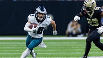 Sep 22, 2024; New Orleans, Louisiana, USA; Philadelphia Eagles wide receiver Britain Covey (18) runs a pass back against New Orleans Saints cornerback Paulson Adebo (29) during the first half at Caesars Superdome.