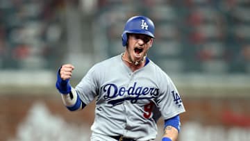 Oct 7, 2018; Atlanta, GA, USA; Los Angeles Dodgers catcher Yasmani Grandal (9) rounds the bases on a two run home run by left fielder Chris Taylor (not pictured) against the Atlanta Braves during the fifth inning of game three of the 2018 NLDS playoff baseball series at SunTrust Park. Mandatory Credit: Brett Davis-Imagn Images