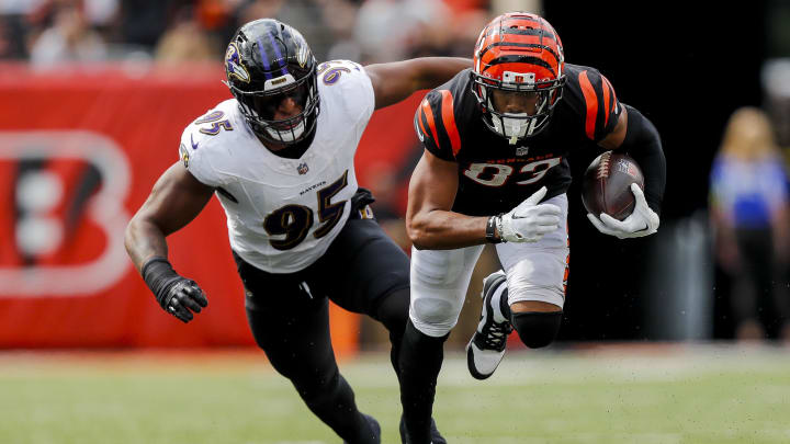 Sep 17, 2023; Cincinnati, Ohio, USA; Cincinnati Bengals wide receiver Tyler Boyd (83) runs with the ball against Baltimore Ravens linebacker Tavius Robinson (95) in the second half at Paycor Stadium. Mandatory Credit: Katie Stratman-USA TODAY Sports