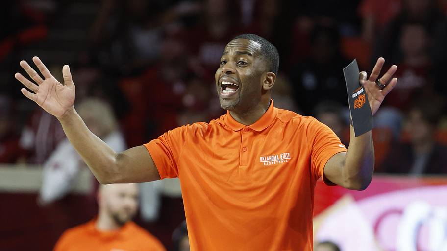 Oklahoma State Cowboys coach Mike Boynton gestures to his team during a play against the Oklahoma Sooners.