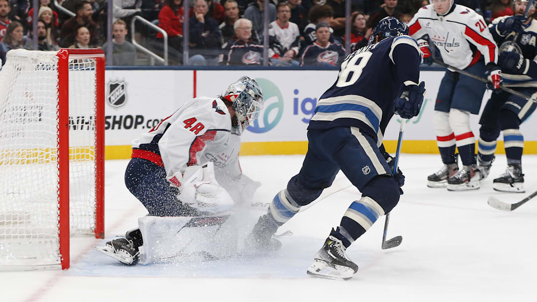 Blue Jackets forward Boone Jenner looks for a rebound on Washington Capitals goaltender Logan Thompson.