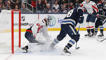 Blue Jackets forward Boone Jenner looks for a rebound on Washington Capitals goaltender Logan Thompson.
