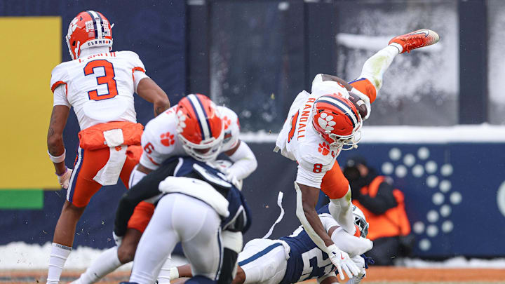 Dec 27, 2025; Bronx, NY, USA; Clemson Tigers running back Adam Randall (8) is tackled byPenn State Nittany Lions cornerback Jahmir Joseph (23) during the first half of the 2025 Pinstripe Bowl at Yankee Stadium. Mandatory Credit: Vincent Carchietta-Imagn Images