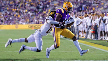 Sep 18, 2021; Baton Rouge, Louisiana, USA;  LSU Tigers wide receiver Kayshon Boutte (1) makes a 2 yard touchdown reception against Central Michigan Chippewas defensive back Donte Kent (19) during the first half at Tiger Stadium. Mandatory Credit: Stephen Lew-Imagn Images