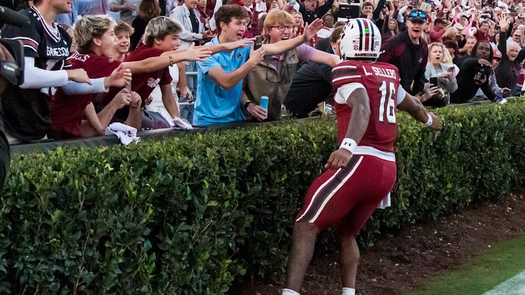 Oct 25, 2025; Columbia, South Carolina, USA; South Carolina Gamecocks quarterback Lanorris Sellers (16) celebrates with fans after scoring a rushing touchdown against the Alabama Crimson Tide in the fourth quarter at Williams-Brice Stadium. Mandatory Credit: Jeff Blake-Imagn Images