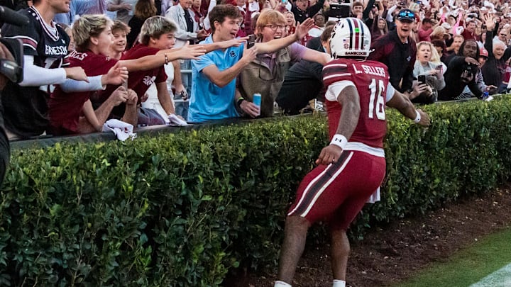 Oct 25, 2025; Columbia, South Carolina, USA; South Carolina Gamecocks quarterback Lanorris Sellers (16) celebrates with fans after scoring a rushing touchdown against the Alabama Crimson Tide in the fourth quarter at Williams-Brice Stadium. Mandatory Credit: Jeff Blake-Imagn Images