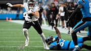 Oct 13, 2024; Charlotte, North Carolina, USA; Atlanta Falcons wide receiver Drake London (5) with the ball as Carolina Panthers linebacker Claudin Cherelus (53) and cornerback Jaycee Horn (8) defend in the second quarter at Bank of America Stadium.