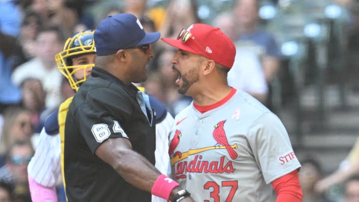 May 12, 2024; Milwaukee, Wisconsin, USA; St. Louis Cardinals manager Oliver Marmol (37) reacts to a call by  umpire Alan Porter (64) and is thrown out of the game against the Milwaukee Brewers din the third inning at American Family Field. Mandatory Credit: Michael McLoone-USA TODAY Sports