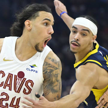 Jaylon Tyson dribbles against Pacers defender Andrew Nembhard 