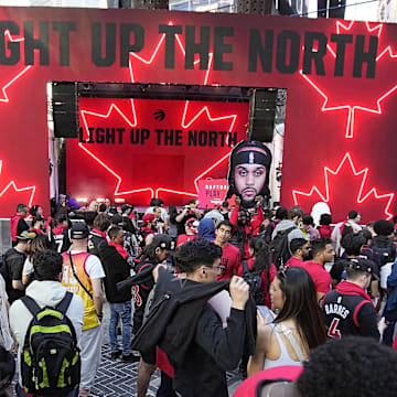 Apr 12, 2023; Toronto, Ontario, CAN; Toronto Raptors fans gather in Jurassic Park at Maple Leafs Square outside of  Scotiabank Arena before during the NBA Play-In game 3 between the Chicago Bulls and Toronto Raptors. Mandatory Credit: John E. Sokolowski-Imagn Images