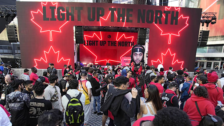 Apr 12, 2023; Toronto, Ontario, CAN; Toronto Raptors fans gather in Jurassic Park at Maple Leafs Square outside of  Scotiabank Arena before during the NBA Play-In game 3 between the Chicago Bulls and Toronto Raptors. Mandatory Credit: John E. Sokolowski-Imagn Images