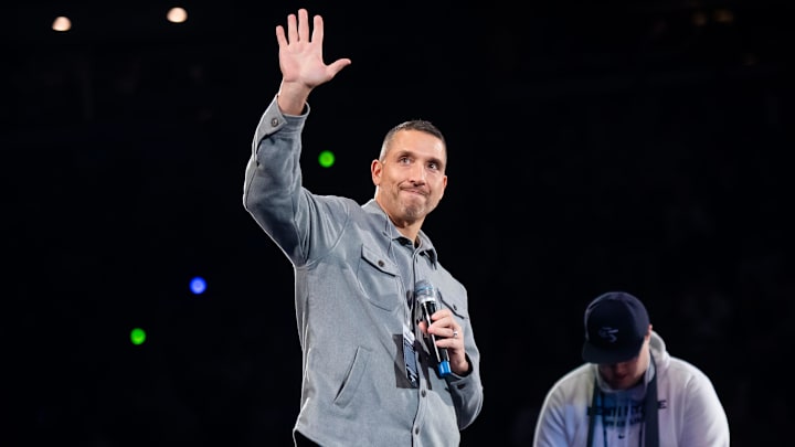 First-year Penn State football head coach Matt Campbell waves to the crowd during a Big Ten wrestling dual meet against Nebraska on January 30, 2026, in State College.
